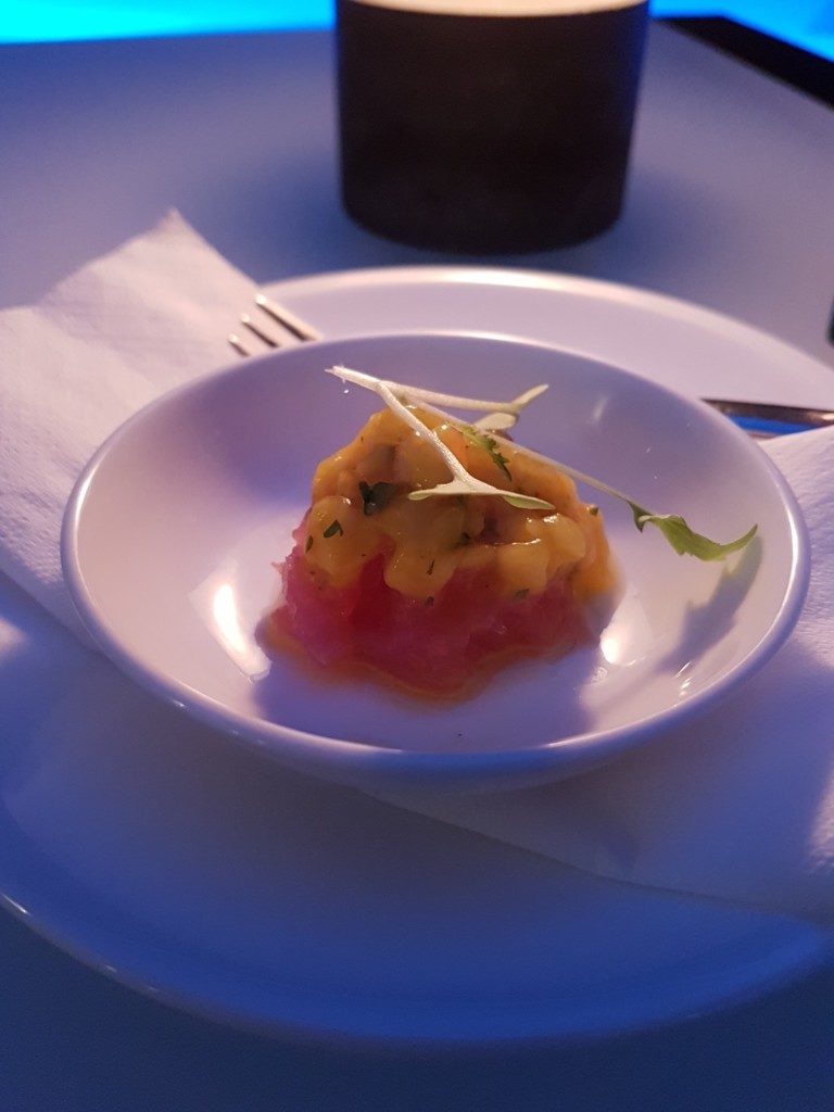 Complimentary amuse bouche - tuna tartare topped with mango