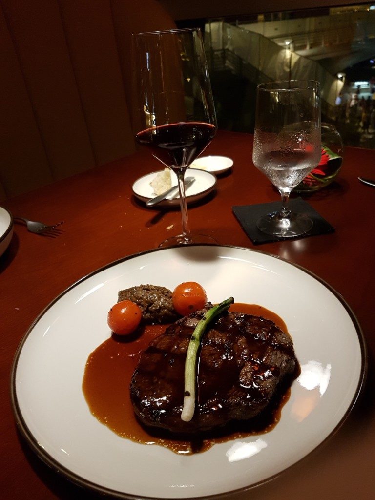 Grilled Wagyu Rib Eye with port wine reduction, grilled green onion and eggplant puree.